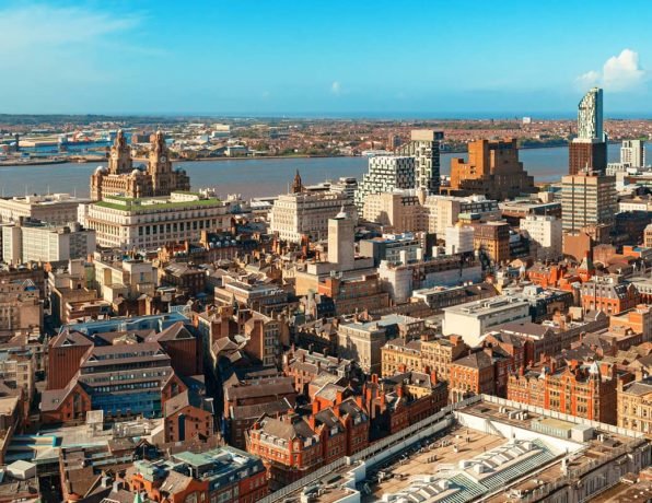 Liverpool waterfront at dusk with historic buildings